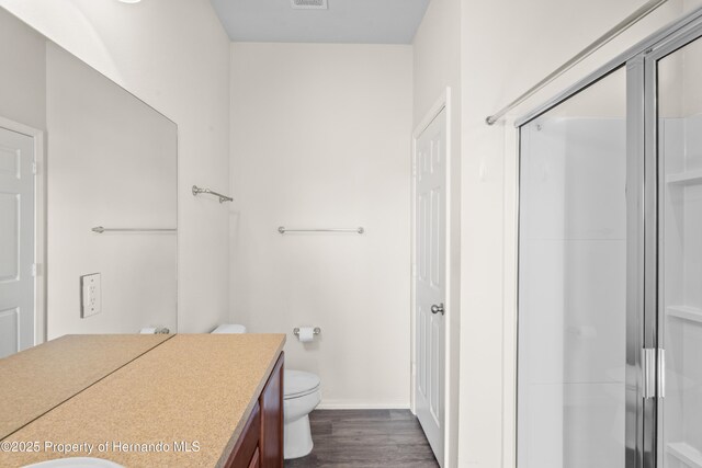 758 Alpine Thistle Dr, Brooksville, FL 34604 - full bathroom with vanity, a stall shower, and wood finished floors