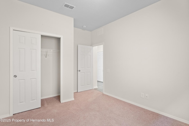 758 Alpine Thistle Dr, Brooksville, FL 34604 - unfurnished bedroom with carpet flooring and a closet