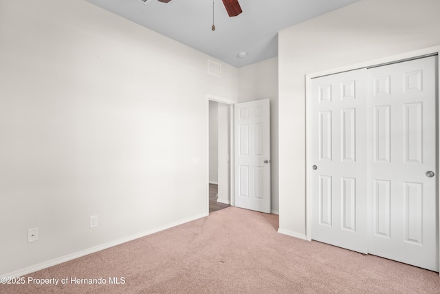 758 Alpine Thistle Dr, Brooksville, FL 34604 - unfurnished bedroom featuring carpet, a closet, and ceiling fan