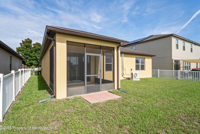 758 Alpine Thistle Dr, Brooksville, FL 34604 - rear view of property featuring a sunroom, stucco siding, and a fenced backyard