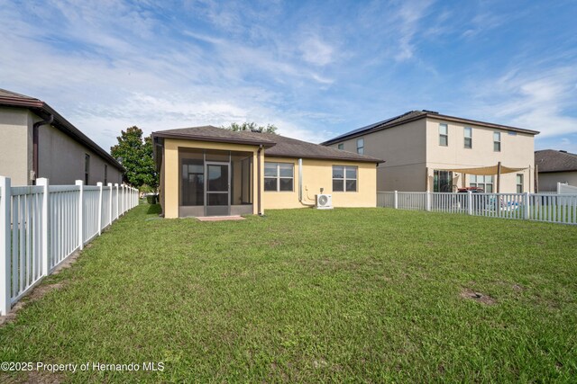 758 Alpine Thistle Dr, Brooksville, FL 34604 - back of house featuring a sunroom, a fenced backyard, and stucco siding