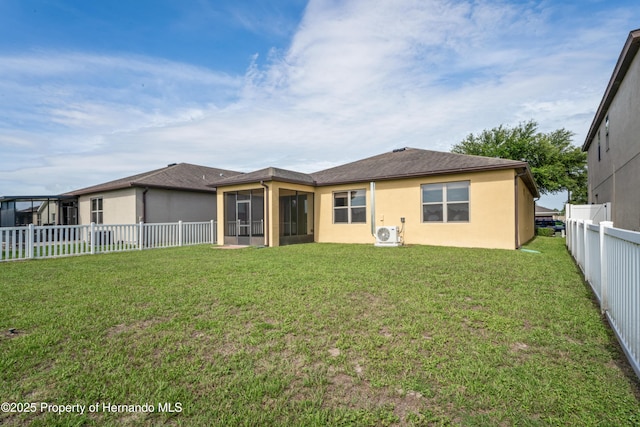 758 Alpine Thistle Dr, Brooksville, FL 34604 - rear view of property with a sunroom, stucco siding, and a fenced backyard