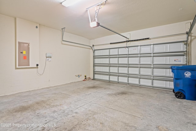 758 Alpine Thistle Dr, Brooksville, FL 34604 - garage with electric panel and a garage door opener