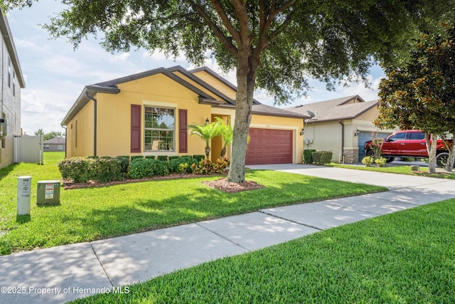 758 Alpine Thistle Dr, Brooksville, FL 34604 - ranch-style house with stucco siding, a garage, a front yard, and driveway
