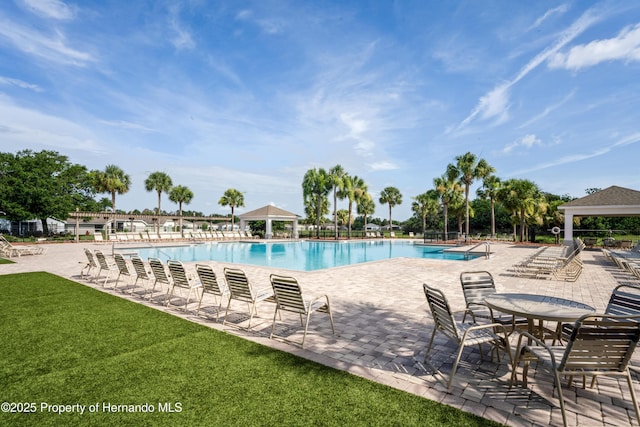 758 Alpine Thistle Dr, Brooksville, FL 34604 - community pool featuring a gazebo, a patio, and a yard