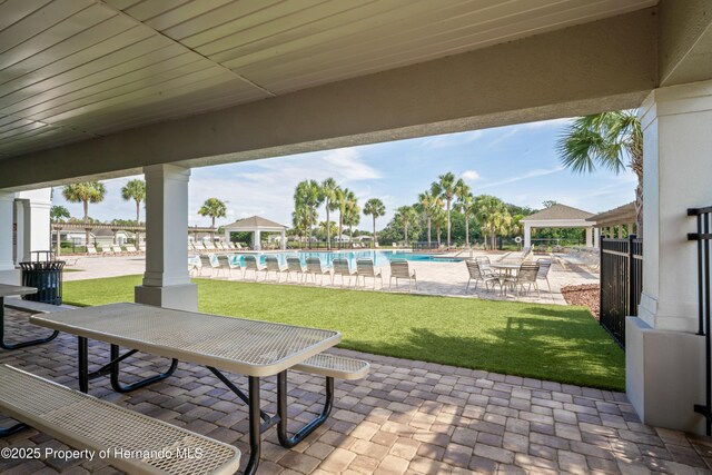 758 Alpine Thistle Dr, Brooksville, FL 34604 - view of patio featuring a gazebo and a community pool