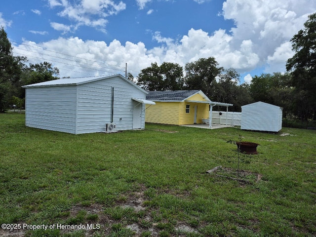 7344 California St, Brooksville, FL 34601 - view of yard featuring an outdoor structure and a patio area