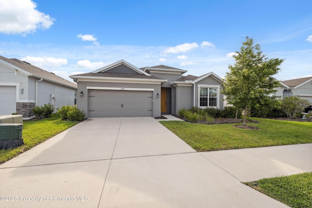 1098 Old Windsor Way, Spring Hill, FL 34609 - view of front of home with a garage, a front yard, concrete driveway, and stucco siding