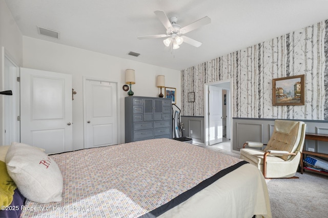 1098 Old Windsor Way, Spring Hill, FL 34609 - carpeted bedroom featuring wallpapered walls, a wainscoted wall, and ceiling fan