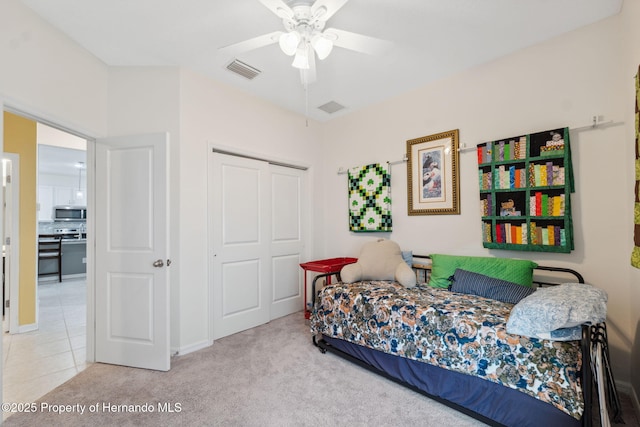 1098 Old Windsor Way, Spring Hill, FL 34609 - carpeted bedroom featuring a closet and ceiling fan