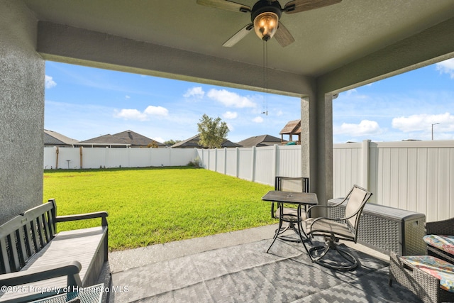 1098 Old Windsor Way, Spring Hill, FL 34609 - fenced backyard with a ceiling fan and a patio
