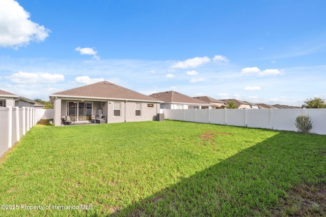 1098 Old Windsor Way, Spring Hill, FL 34609 - back of property with a fenced backyard and stucco siding
