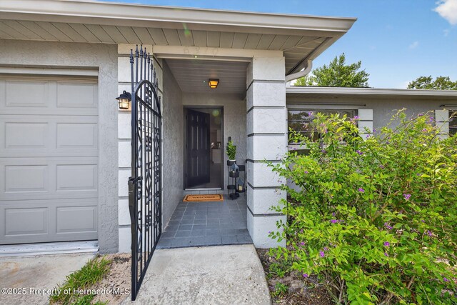 6310 Gainsboro Ave, Spring Hill, FL 34609 - view of exterior entry featuring stucco siding