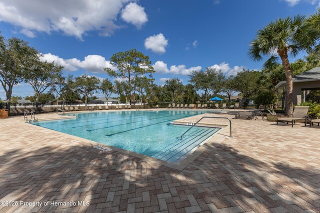 109 Fairmont Dr, Spring Hill, FL 34609 - community pool featuring a patio area