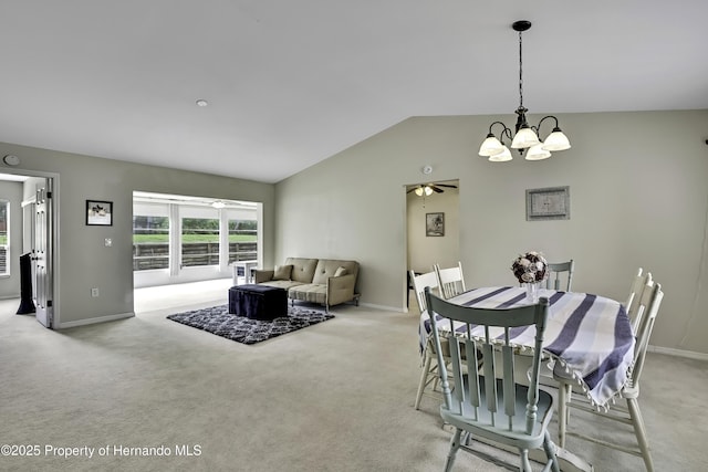 7385 Crestwood Dr, Weeki Wachee, FL 34613 - dining space with a chandelier, light carpet, lofted ceiling, and a ceiling fan