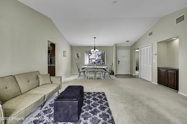 7385 Crestwood Dr, Weeki Wachee, FL 34613 - living room with vaulted ceiling, a chandelier, and light carpet