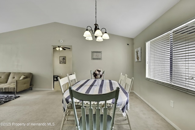 7385 Crestwood Dr, Weeki Wachee, FL 34613 - dining area featuring vaulted ceiling, light colored carpet, a chandelier, and ceiling fan