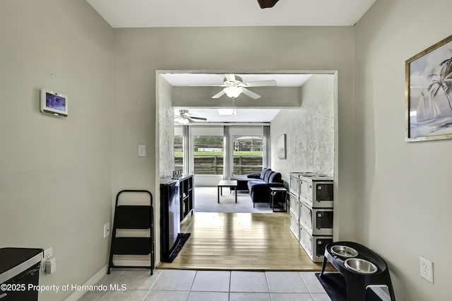 7385 Crestwood Dr, Weeki Wachee, FL 34613 - hallway with light tile patterned floors