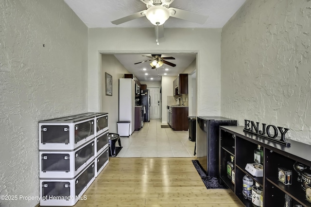 7385 Crestwood Dr, Weeki Wachee, FL 34613 - hallway featuring a textured wall and light wood-style floors
