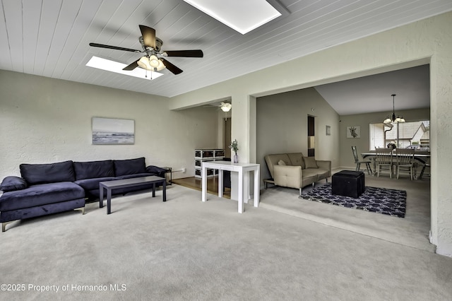 7385 Crestwood Dr, Weeki Wachee, FL 34613 - carpeted living area with a ceiling fan and a chandelier