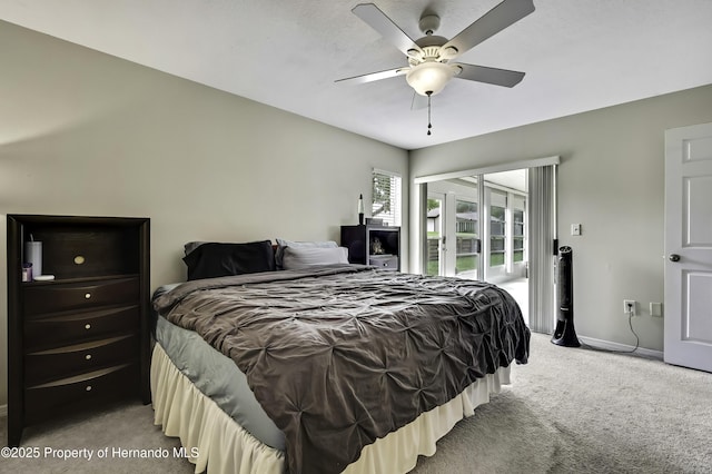 7385 Crestwood Dr, Weeki Wachee, FL 34613 - carpeted bedroom with access to outside and a ceiling fan