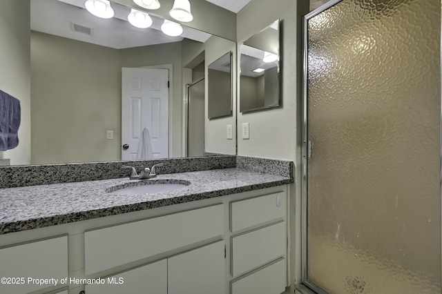 7385 Crestwood Dr, Weeki Wachee, FL 34613 - bathroom featuring a stall shower and vanity