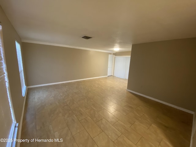 1392 Piper Rd, Spring Hill, FL 34606 - empty room with baseboards and ornamental molding