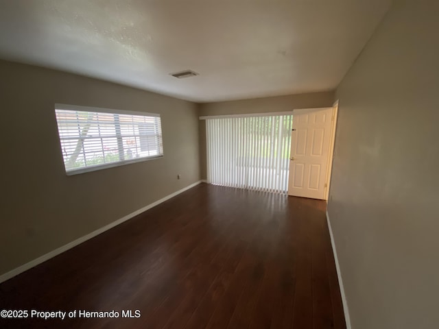 1392 Piper Rd, Spring Hill, FL 34606 - spare room with dark wood-style floors