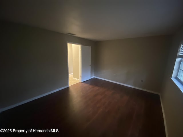 1392 Piper Rd, Spring Hill, FL 34606 - empty room with wood finished floors and baseboards