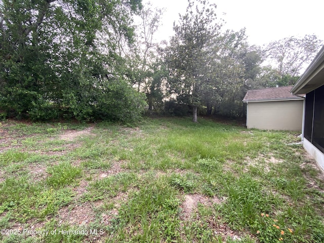 1392 Piper Rd, Spring Hill, FL 34606 - view of yard with a sunroom