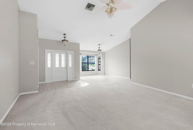 13125 Jessica Dr, Spring Hill, FL 34609 - unfurnished living room featuring light colored carpet, lofted ceiling, and ceiling fan