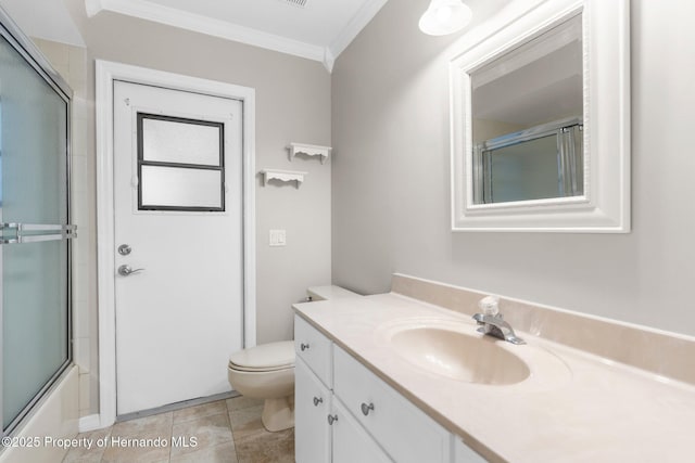 13125 Jessica Dr, Spring Hill, FL 34609 - full bathroom with ornamental molding, vanity, bath / shower combo with glass door, and tile patterned flooring