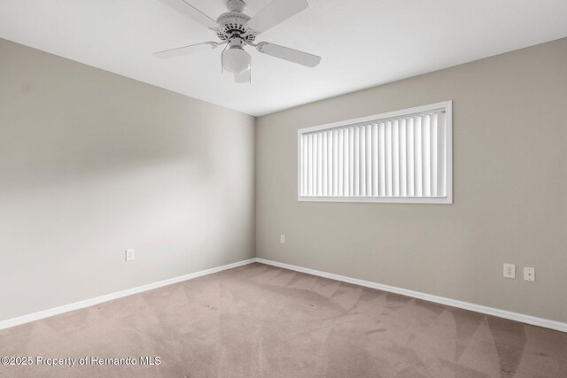 13125 Jessica Dr, Spring Hill, FL 34609 - carpeted empty room with baseboards and ceiling fan
