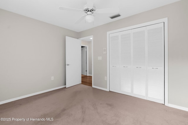 13125 Jessica Dr, Spring Hill, FL 34609 - unfurnished bedroom with carpet floors, a closet, and a ceiling fan