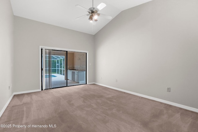 13125 Jessica Dr, Spring Hill, FL 34609 - empty room featuring light colored carpet, a ceiling fan, and high vaulted ceiling