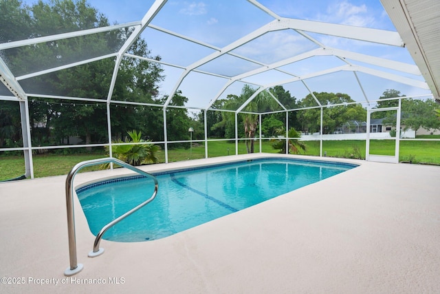 13125 Jessica Dr, Spring Hill, FL 34609 - swimming pool with a patio, a lawn, and glass enclosure