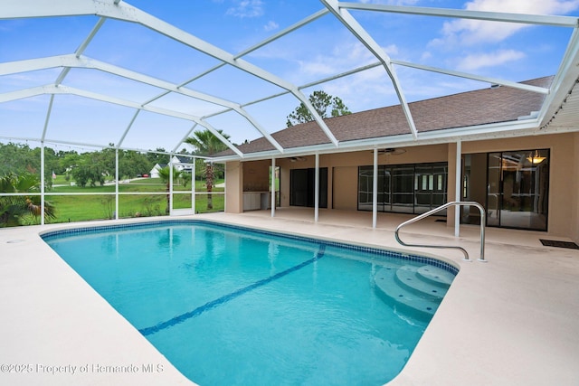 13125 Jessica Dr, Spring Hill, FL 34609 - swimming pool featuring a ceiling fan, a patio, and glass enclosure