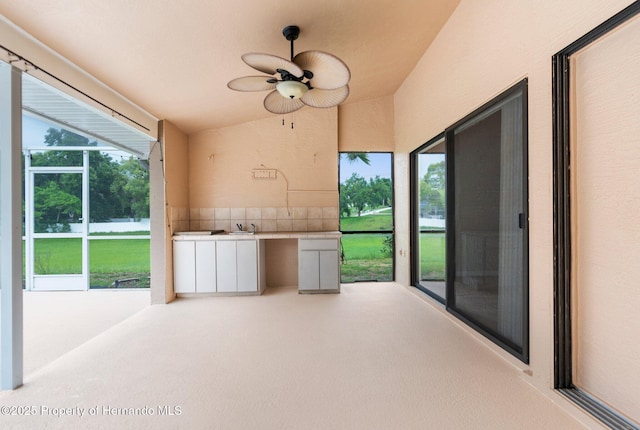 13125 Jessica Dr, Spring Hill, FL 34609 - unfurnished sunroom featuring lofted ceiling