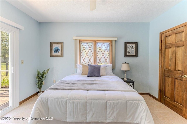 4276 River Birch Dr, Spring Hill, FL 34607 - bedroom featuring multiple windows, access to exterior, light tile patterned floors, and a ceiling fan