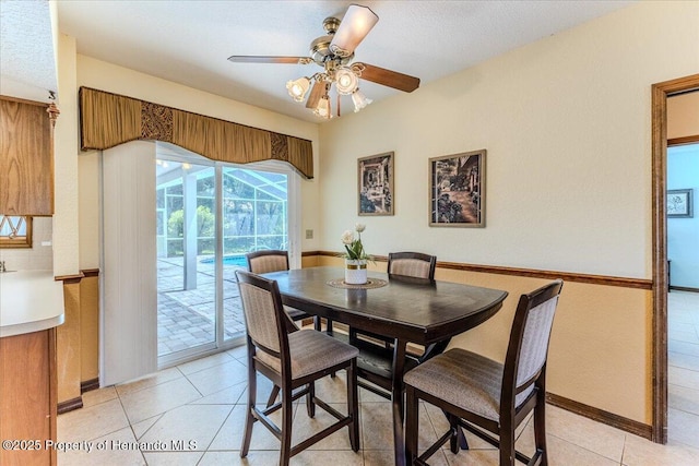 4276 River Birch Dr, Spring Hill, FL 34607 - dining space with ceiling fan, light tile patterned floors, and a sunroom