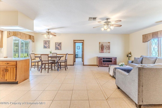 4276 River Birch Dr, Spring Hill, FL 34607 - living room featuring a ceiling fan and light tile patterned flooring