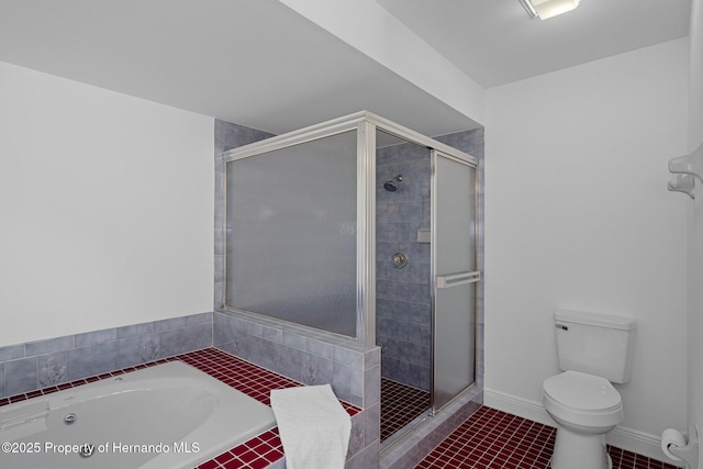8410 Lakehill Ct, Spring Hill, FL 34608 - bathroom featuring a stall shower, a bath, and tile patterned flooring