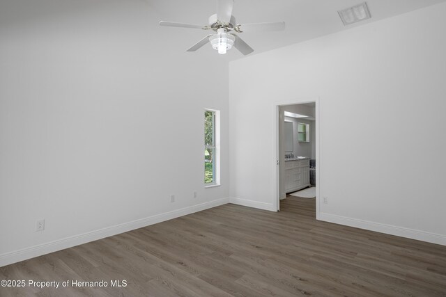 8410 Lakehill Ct, Spring Hill, FL 34608 - spare room featuring wood finished floors and a ceiling fan