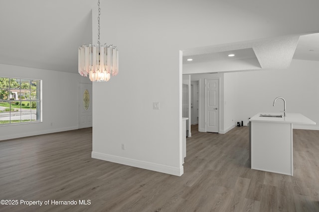 8410 Lakehill Ct, Spring Hill, FL 34608 - unfurnished dining area with a chandelier, light wood-style floors, and recessed lighting