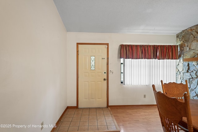 13345 Convent Garden Rd, Brooksville, FL 34613 - foyer entrance featuring baseboards and light wood-type flooring