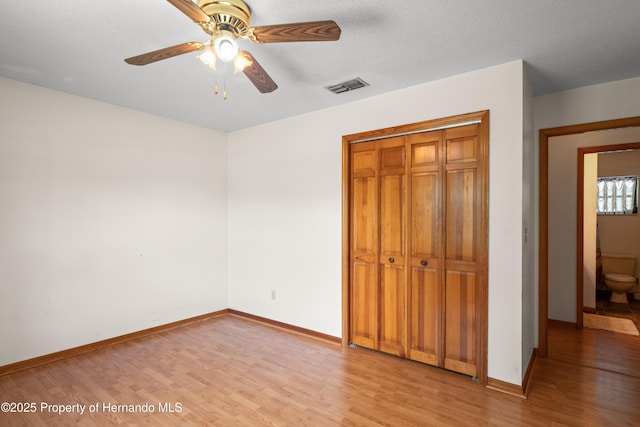 13345 Convent Garden Rd, Brooksville, FL 34613 - unfurnished bedroom featuring light wood finished floors, a closet, and a ceiling fan