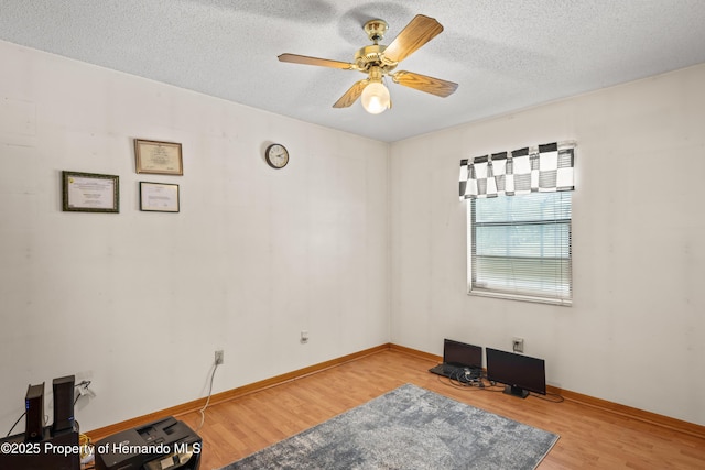 13345 Convent Garden Rd, Brooksville, FL 34613 - unfurnished room with wood finished floors, ceiling fan, and a textured ceiling
