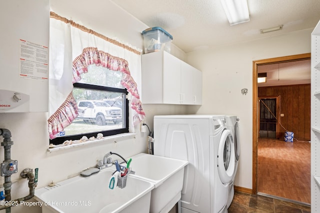 13345 Convent Garden Rd, Brooksville, FL 34613 - laundry room with gas water heater, cabinet space, attic access, washer and dryer, and a textured ceiling