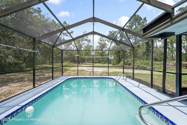 13345 Convent Garden Rd, Brooksville, FL 34613 - outdoor pool with a lanai and a lawn