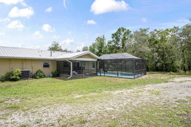 13345 Convent Garden Rd, Brooksville, FL 34613 - view of grassy yard featuring a detached carport and a lanai